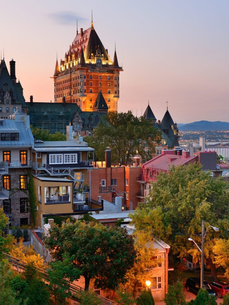 Quebec City skyline with Chateau Frontenac at sunset viewed from hill